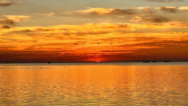 Oh the colors of the sunsets over water!