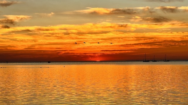 Oh the colors of the sunsets over water!